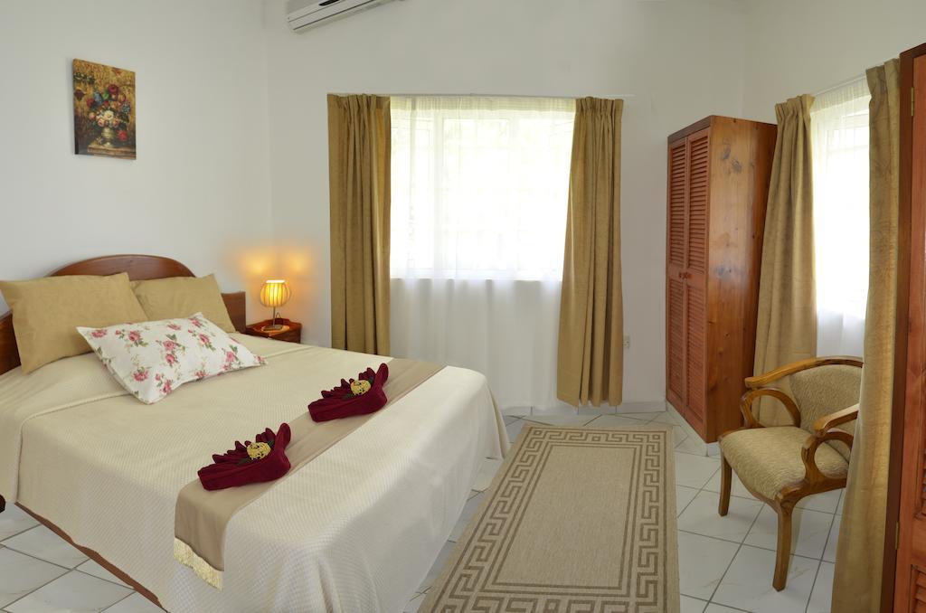 Ixora Villa Anse Royale Quarto foto